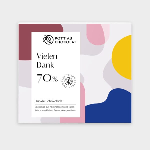 Verpackung unserer dunklen Motto Schokolade "Vielen Danke". Heller Hintergrund mit grafisch dargestellten braun, blau, gelb, grau, rosa Flächen darauf ein weißes Rechteck mit der Bezeichnung und unserem Logo